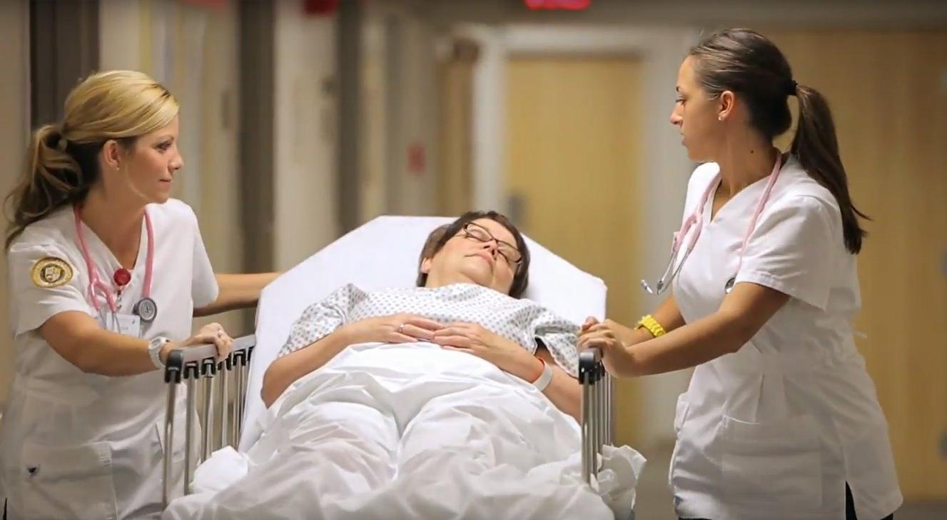 Nurses treat elderly patient
